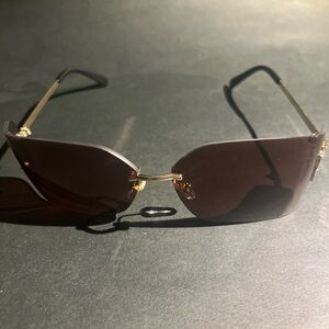 Miu Miu Gold and Brown Rimless Sunglasses